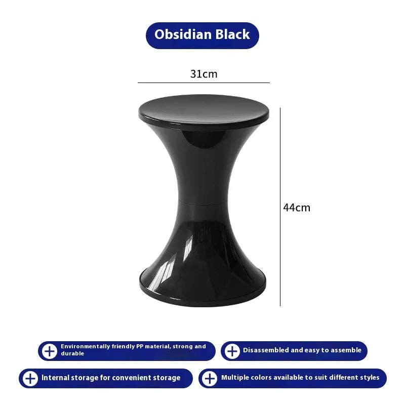 Green hourglass-shaped plastic stool for changing shoes, suitable for children and adults.