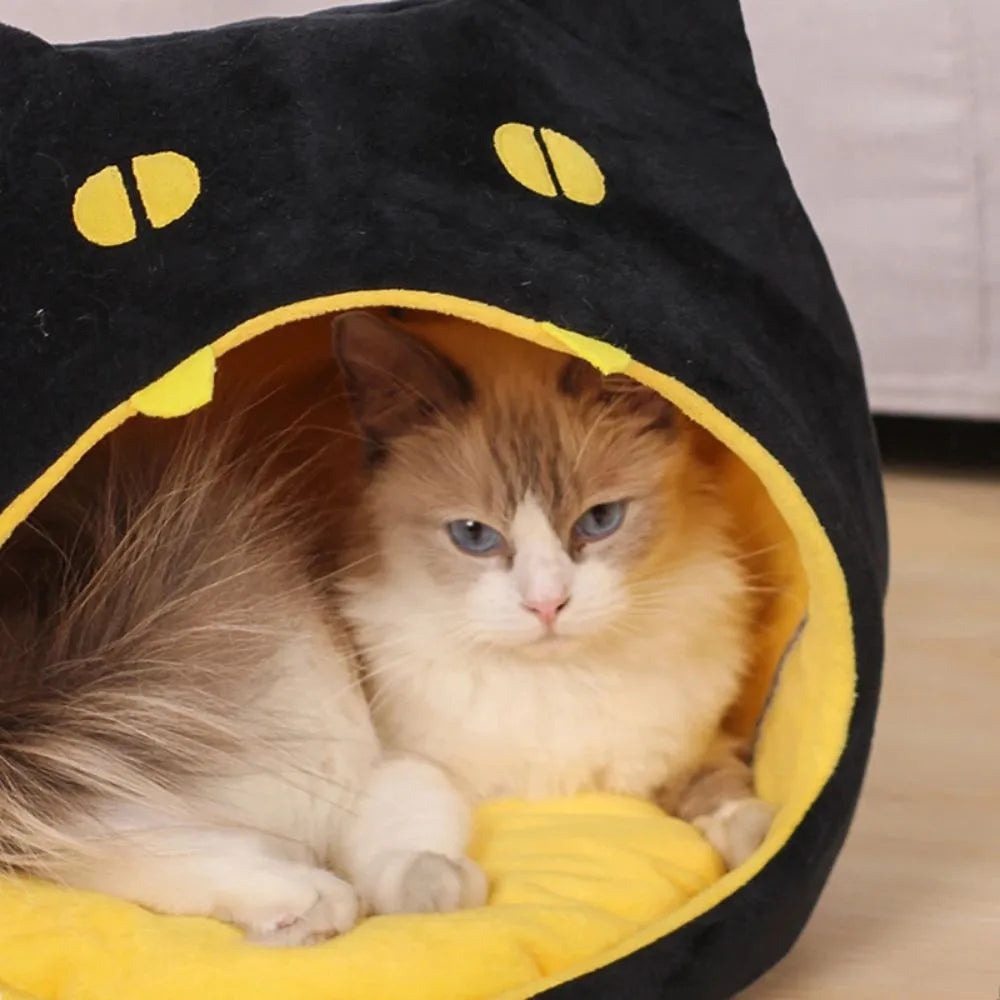 Soft warm cat bed in cat shape design with anti-slip bottom, machine washable, available in S and L sizes.