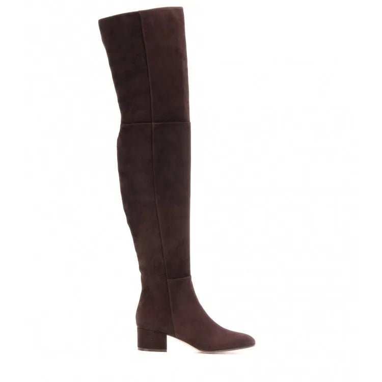 Women's grey suede over the knee flat boots with a low thick heel and pointed toe on a neutral background.