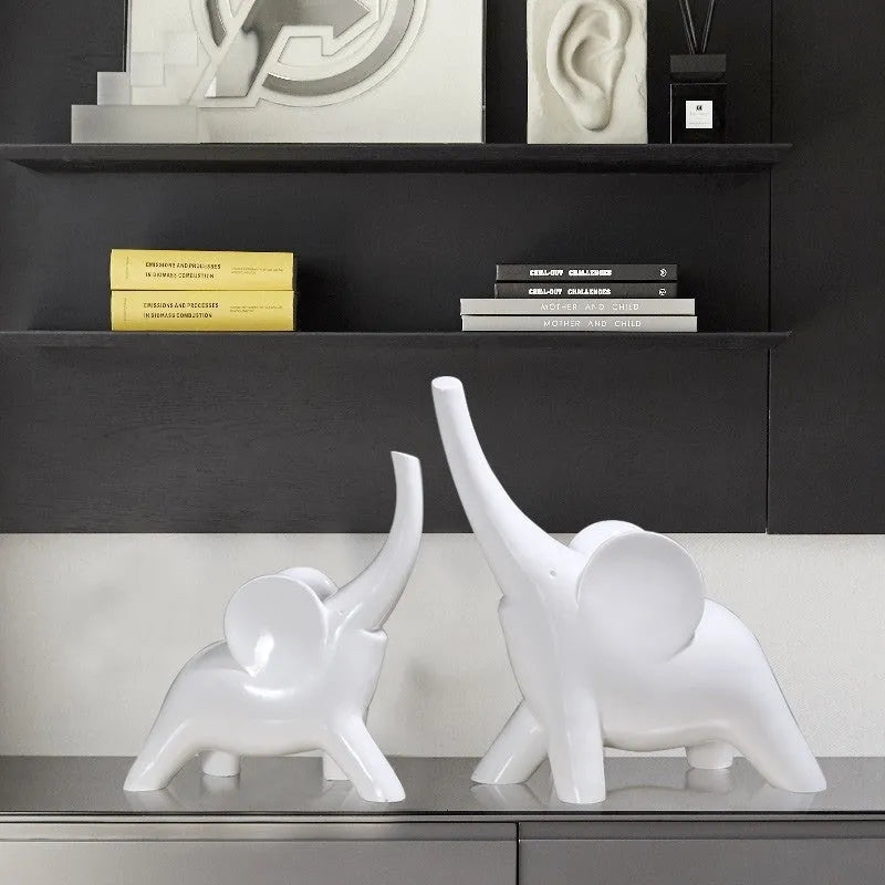 Modern resin elephant ornament in rose gold or white colour, available in large and small sizes.