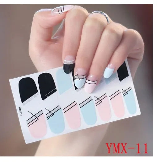 Full nail stickers set of 14 sheets showing 16 colour options in a flat lay arrangement