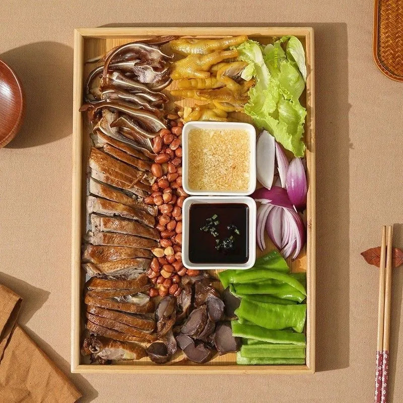 Square brown-handled bamboo serving tray on a table, pastoral style.