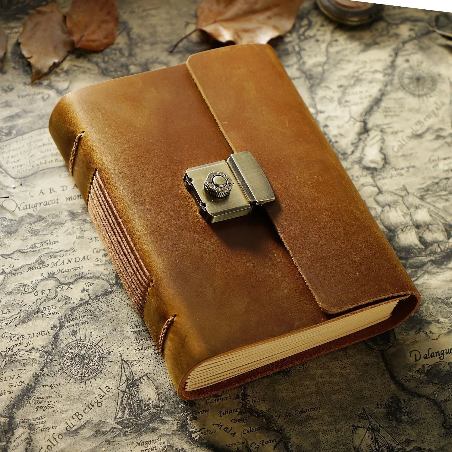 Vintage cowhide leather journal open on blank brown paper pages, A5 size, Crazy Horse brown colour with distressed finish