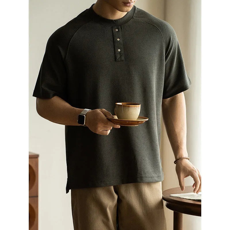 Casual loose top with raglan sleeves in terry texture fabric available in smoky grey, white, and black colours