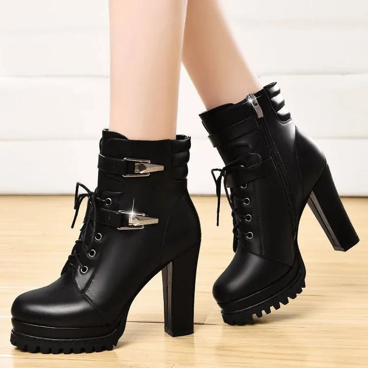 Black round toe thick heel women's high heel shoes with rubber sole on a white background