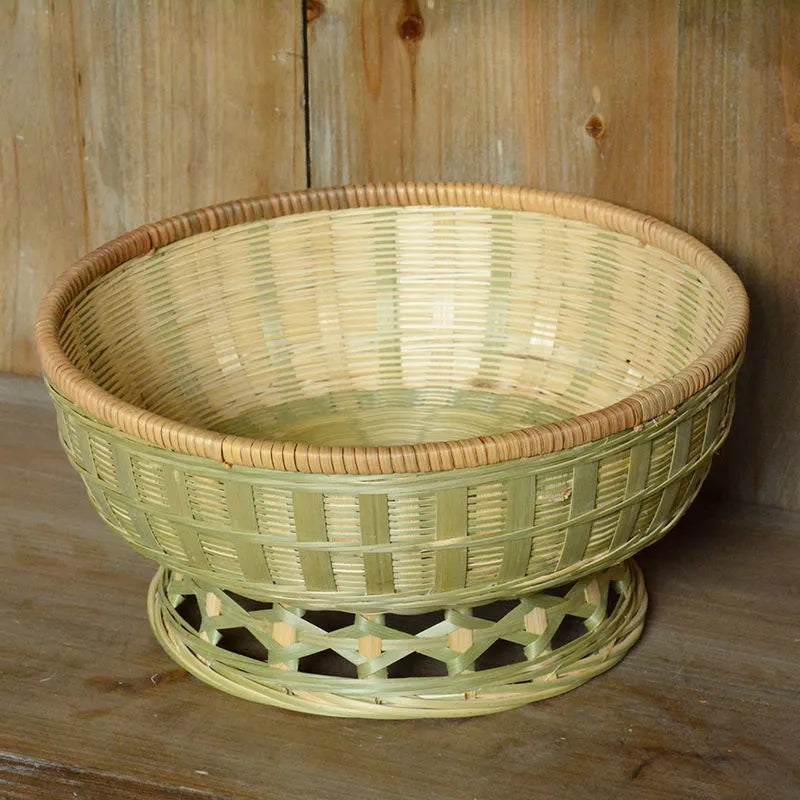 Three handmade bamboo storage baskets in different sizes including one with deepening design