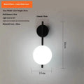 Black wrought iron Nordic wall lamp with milky white glass cover, 12cm wide and 30cm high, for balcony or stairway installation