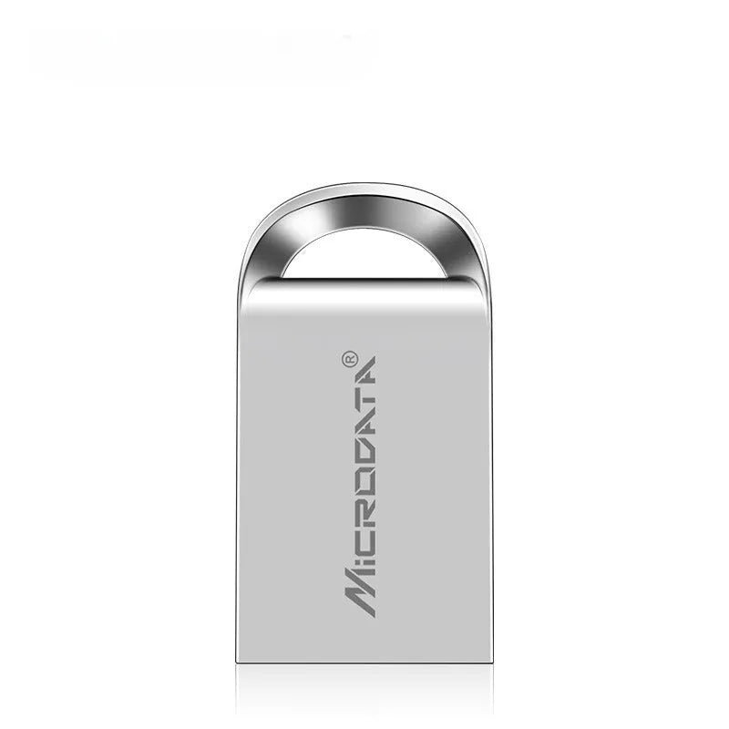 Silver car-shaped metal USB flash drive on a chain, shown next to a laptop.