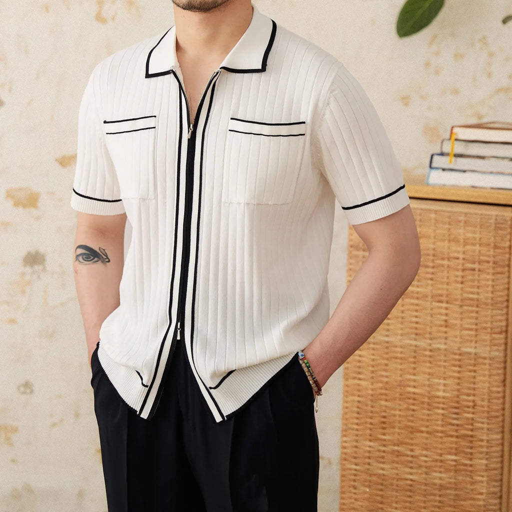 Slim black and white elastic knit polo shirt with lapel collar and short sleeves on hanger