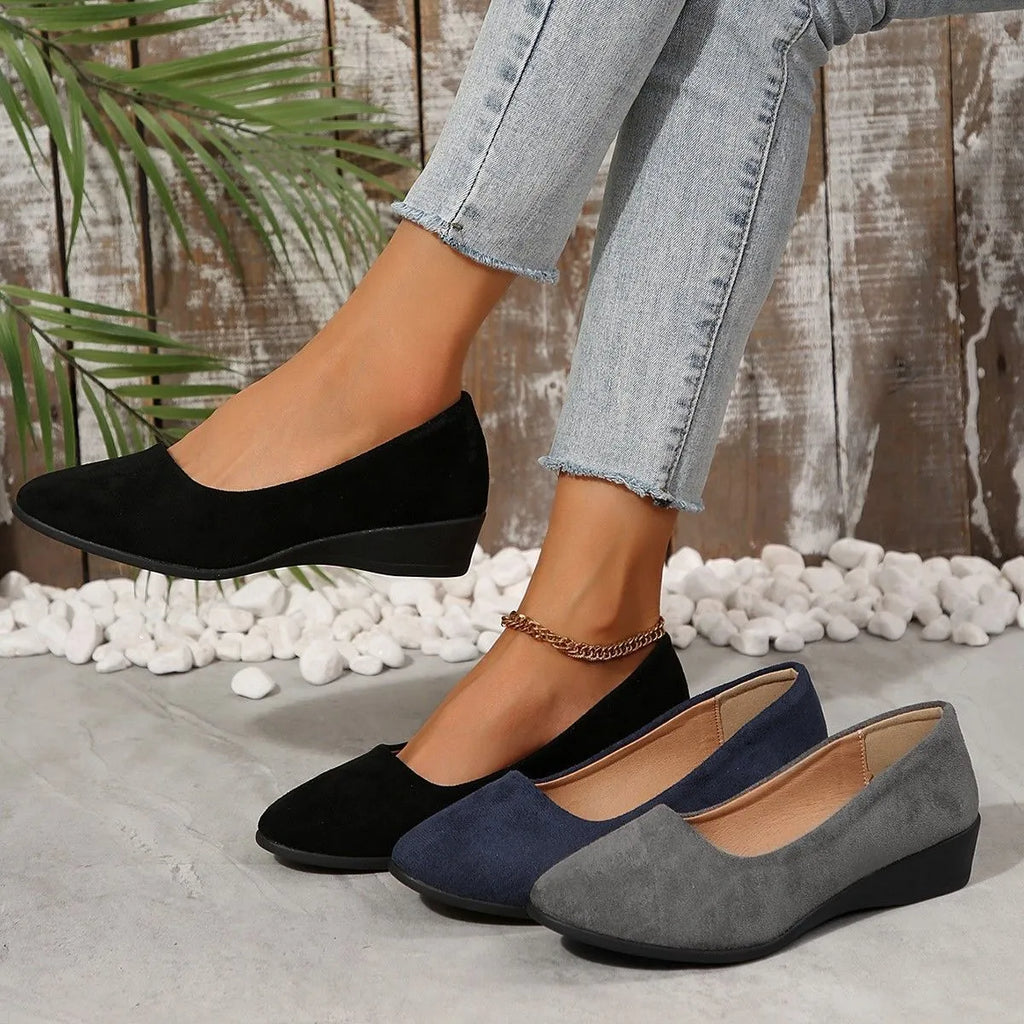 Women's pointed toe wedge pumps in suede with low wedge heel