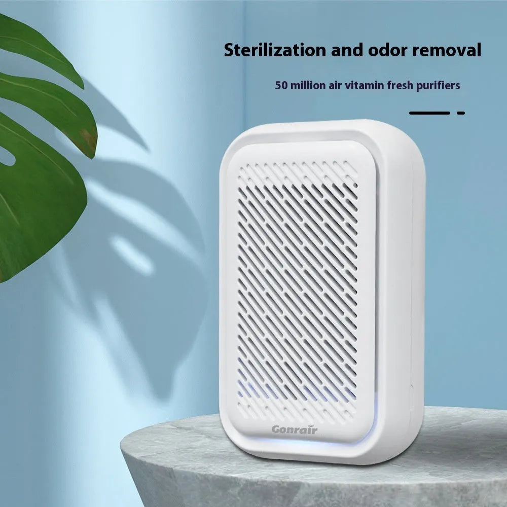 White wall-mounted direct plug-in air purifier unit for small rooms.