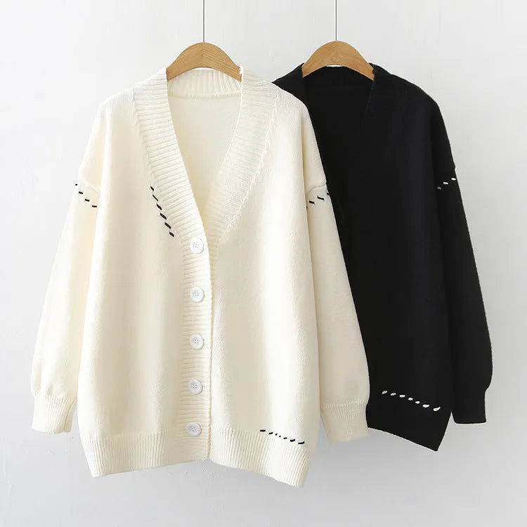 Women's knitted cardigan top coat in black or white with loose fit and long sleeves