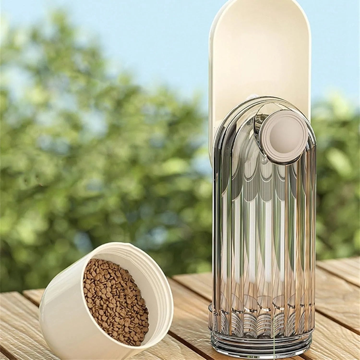 Beige foldable dog water bottle with food container base for outdoor use