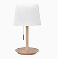 Walnut coloured solid wood bedside table lamp with a white cloth lampshade.