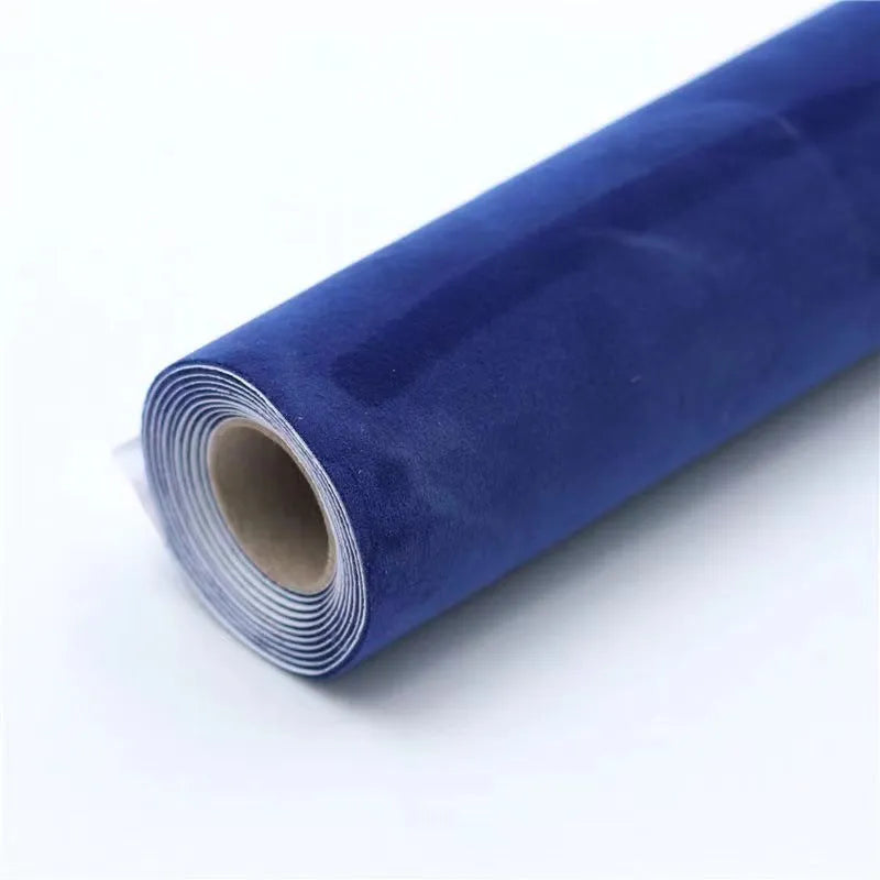 Rolls and sheets of coloured self-adhesive suede leather material for DIY projects.