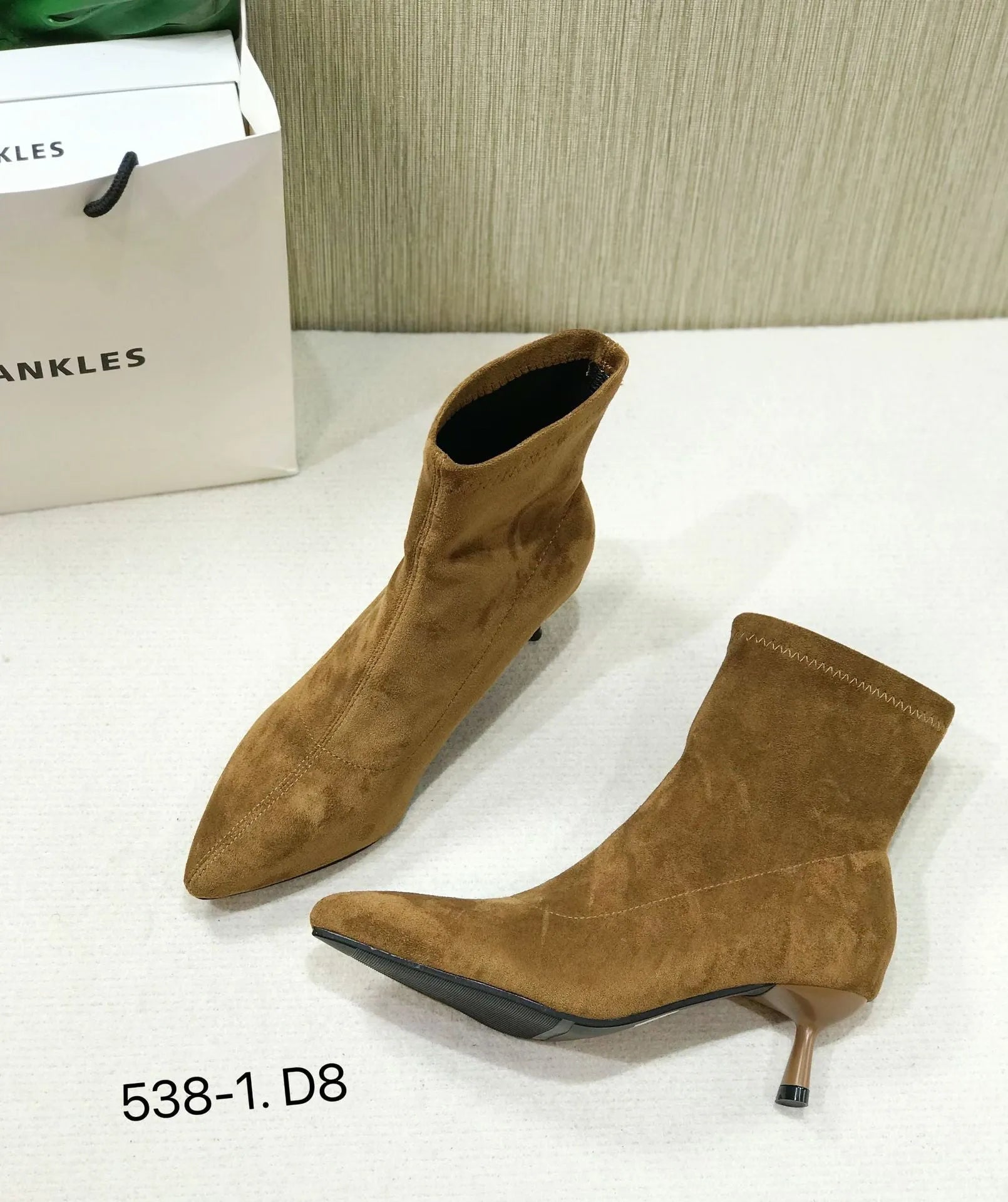 Black pointed toe women's ankle boots with stiletto heel and mid-calf height