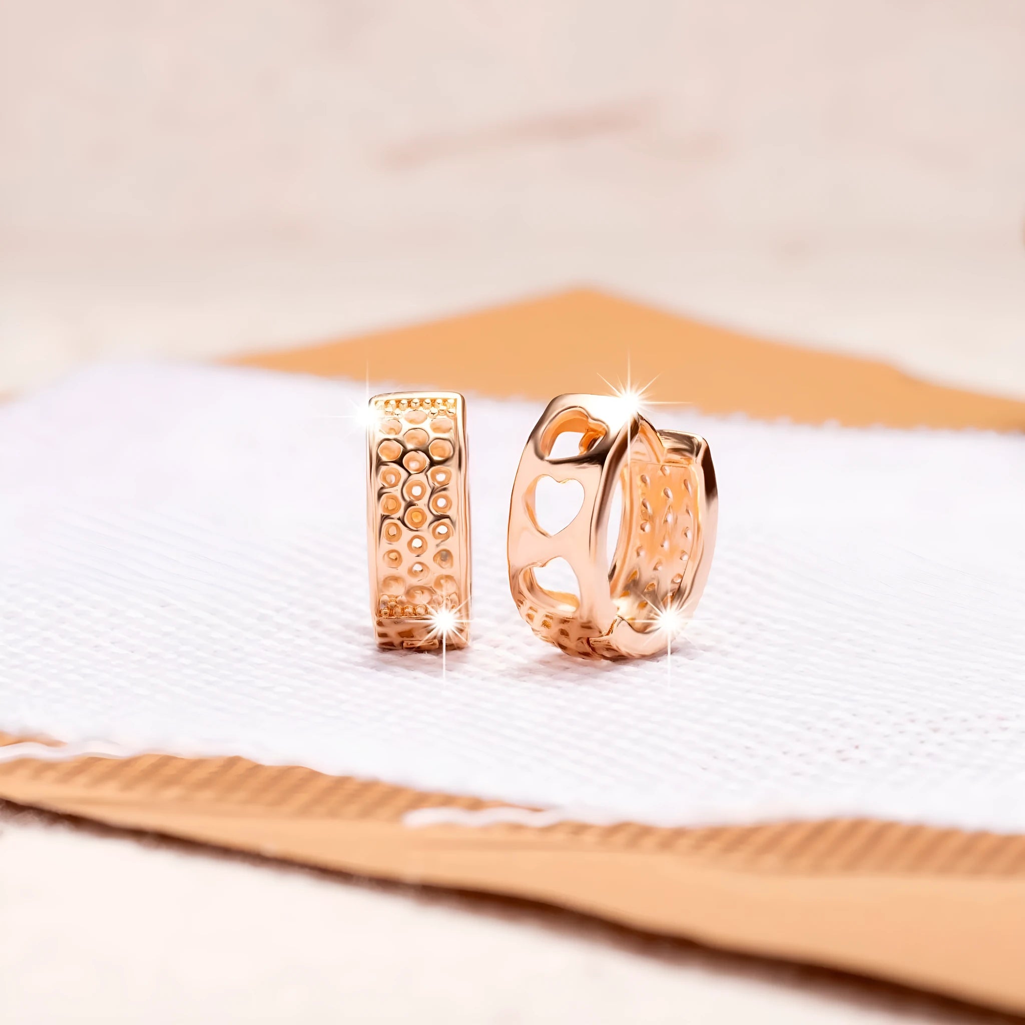 Rose gold hollowed out heart-shaped stud earrings for women, fresh sweet style.