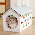 Integrated plastic cat scratch board with nest bed and tunnel containing bell ball