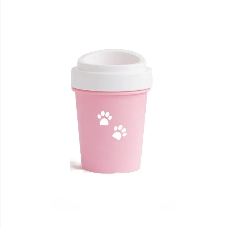 Blue silicone dog paw cleaner cup with soft bristles and easy-grip design on a white surface