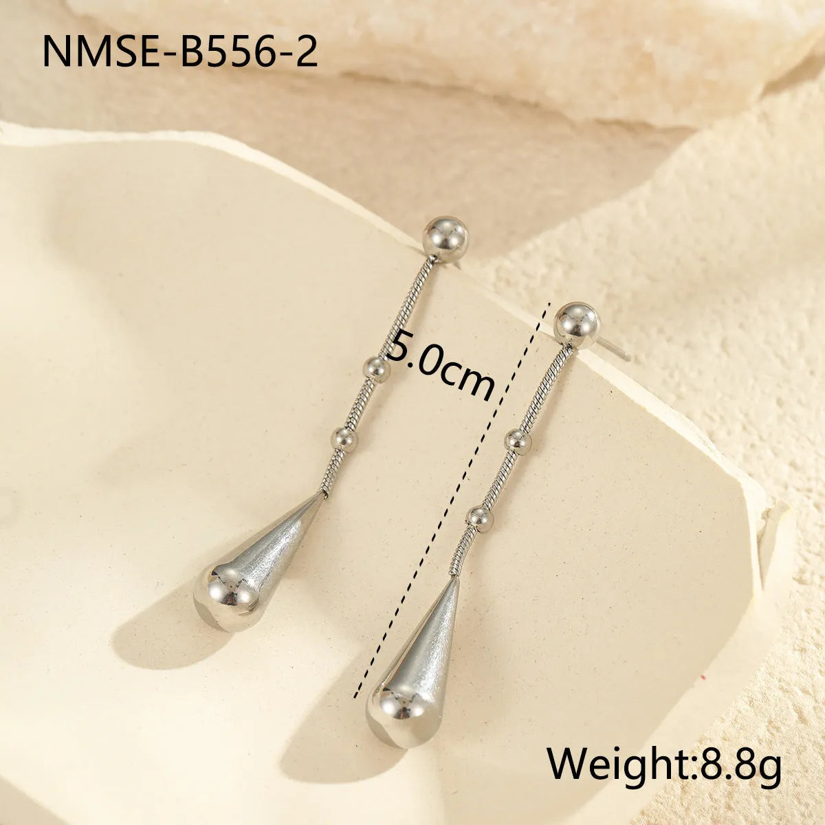 Stainless steel tassel water drop earrings with Y-word chain ornament in 18K gold electroplated finish, geometric drop-shaped design
