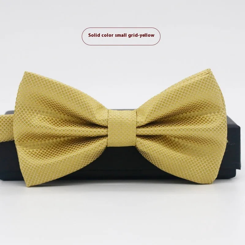 Solid colour flat head bow tie for formal wear in multiple colours including black, red, and blue.