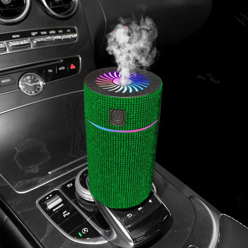 Compact white car air humidifier and purifier with USB cable on a car dashboard