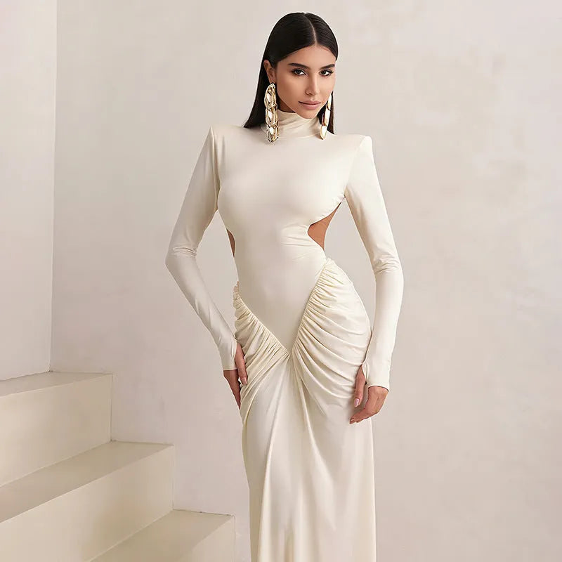 Women's slim fit long sleeve dress with high collar and pleated backless detail in light apricot colour