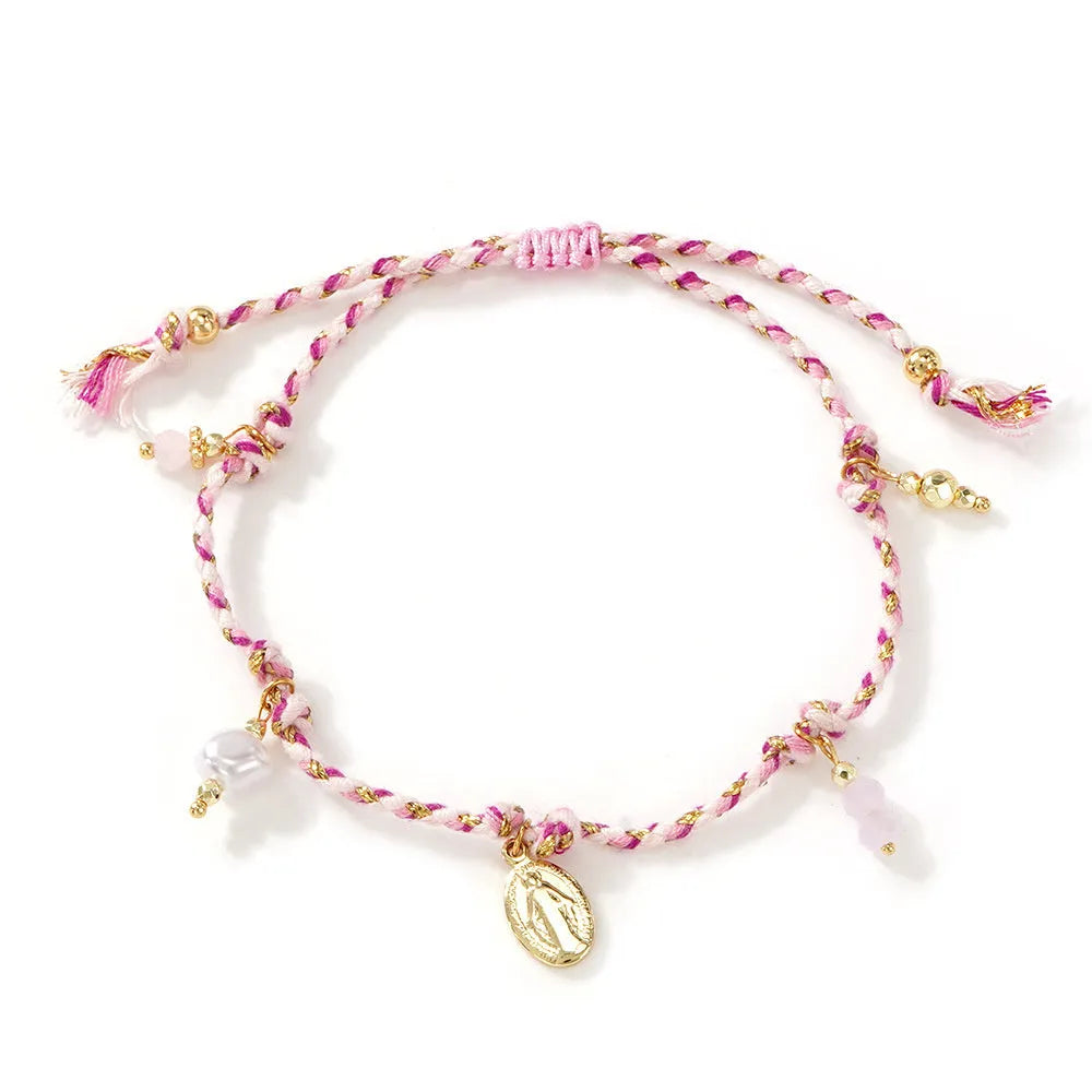Hand-woven women's bracelet made from colourful braided rope with an integrated carrying strap tag design.