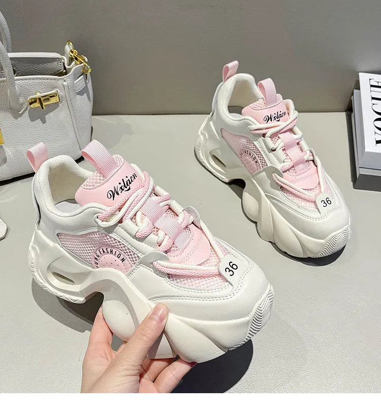Women's pink sneakers with cross shoulder straps and thick sole design