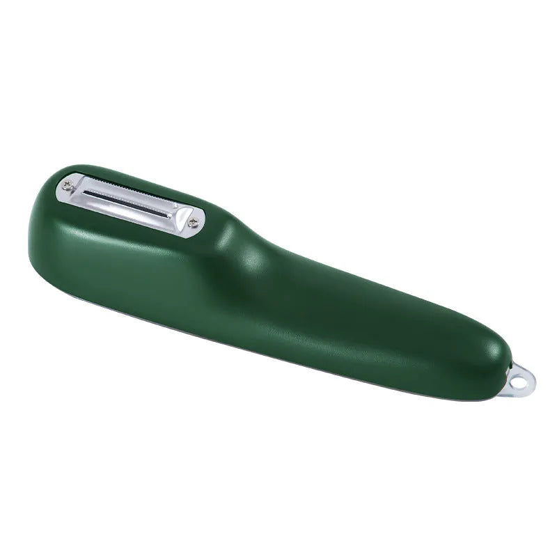 Green vegetable peeler with storage tube, non-slip handle, and hang hole on a kitchen worktop.