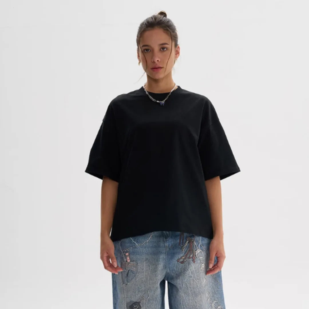 Pure cotton loose fit short sleeve t-shirt in apricot colour on a hanger.