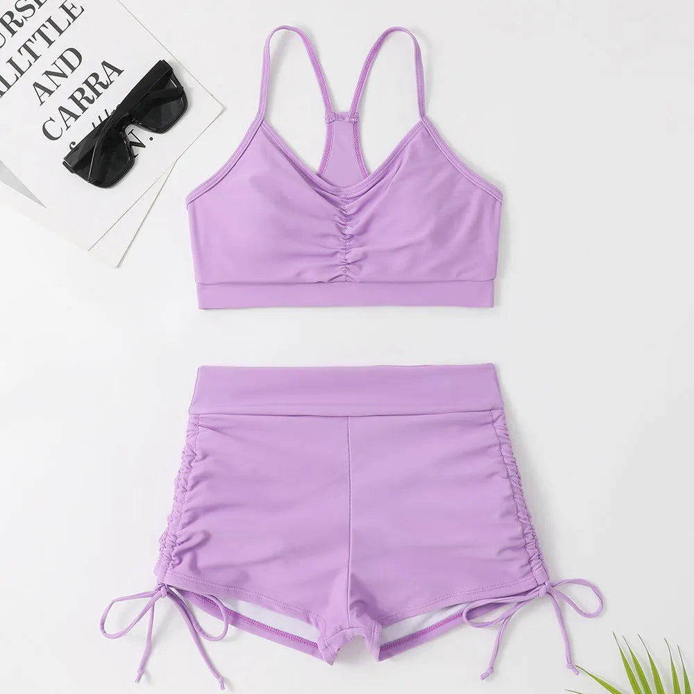 Purple and black women's high waist bikini swimsuit set on a mannequin.