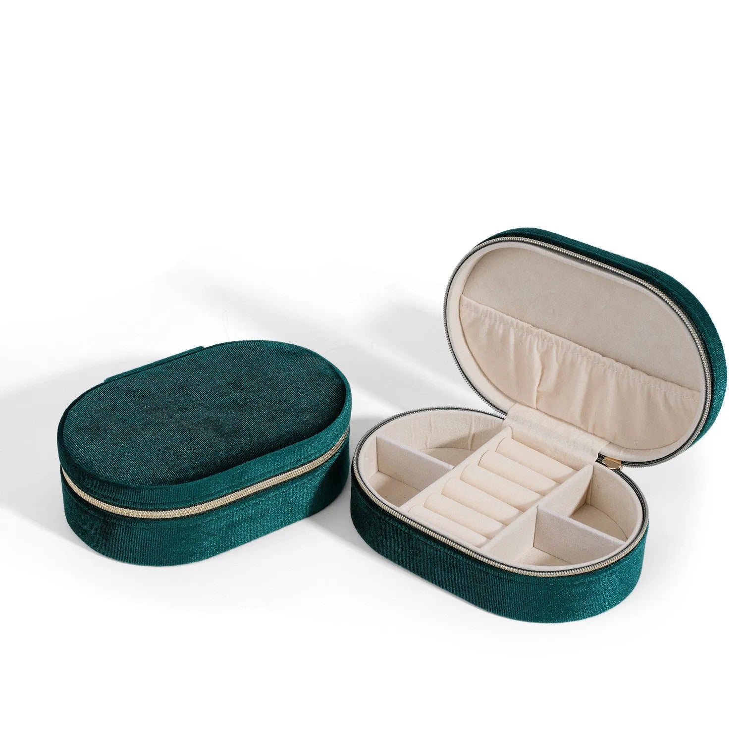 Oval velvet jewellery box with handle in lake blue colour, showing flannel-lined interior.