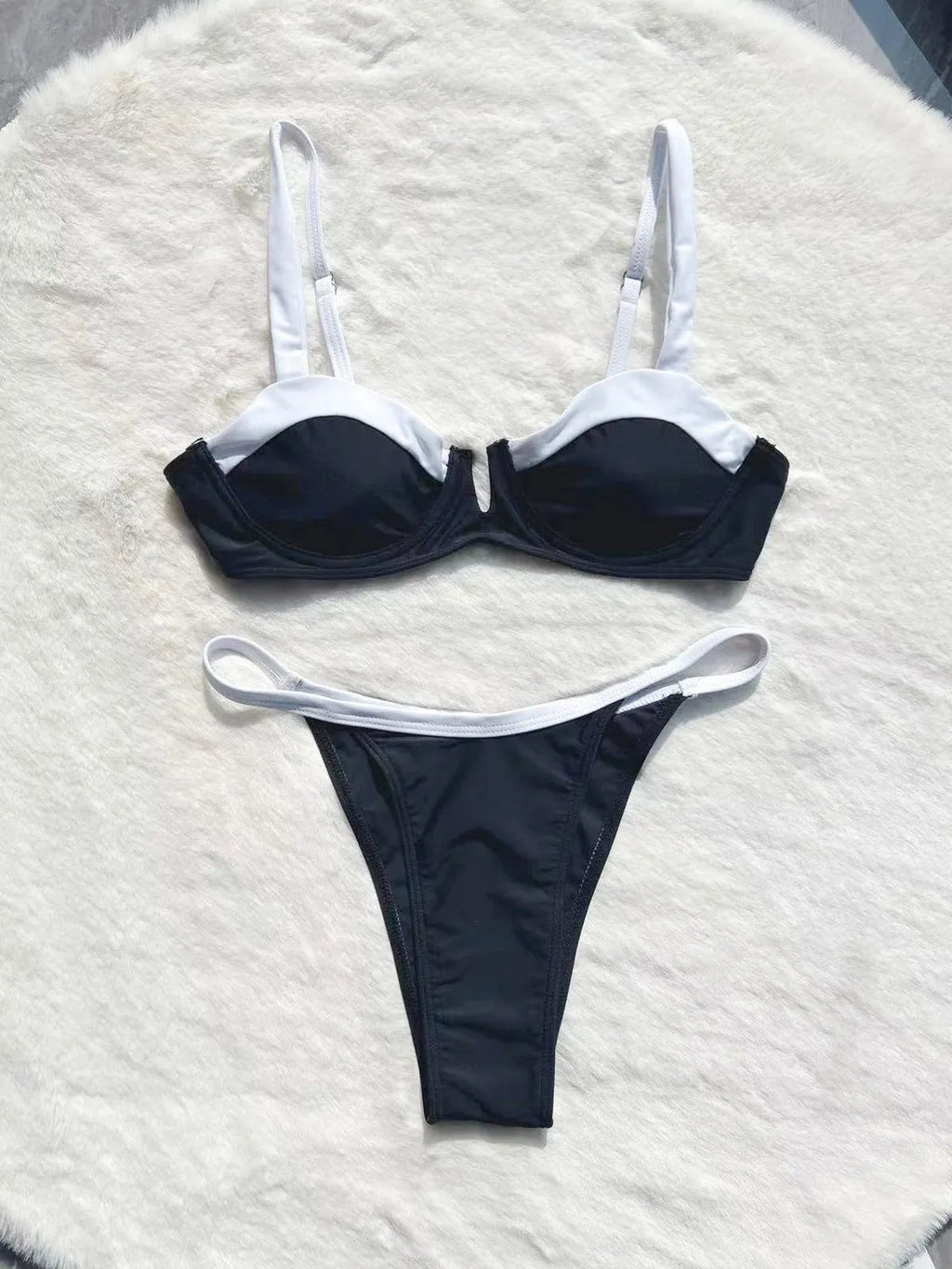 Black low waist women's bikini swimsuit with stitching split detail on briefs