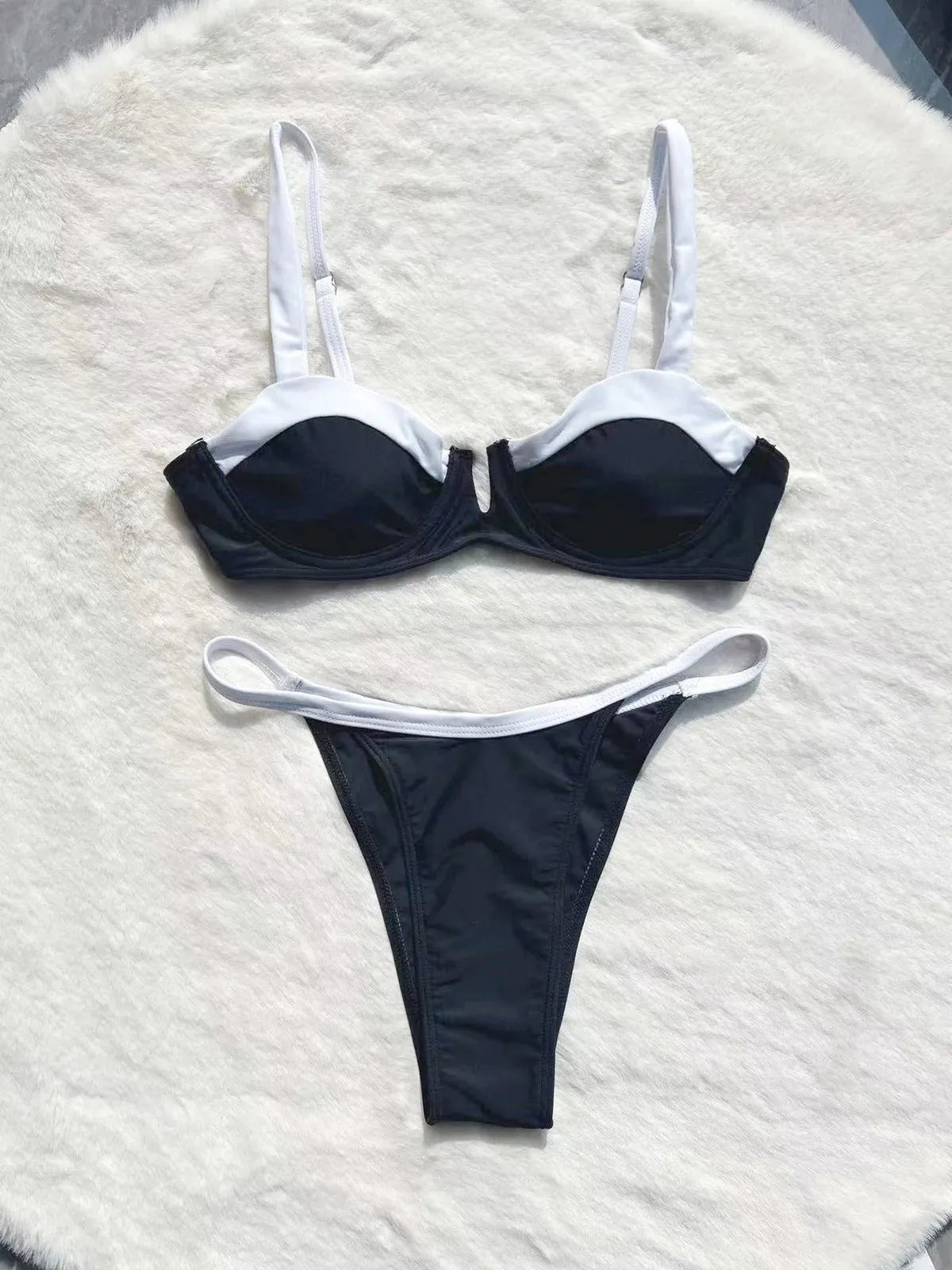 Black low waist women's bikini swimsuit with stitching split detail on briefs