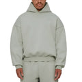 Man wearing a solid colour fleece-lined cotton hoodie sweater with a wool lining.