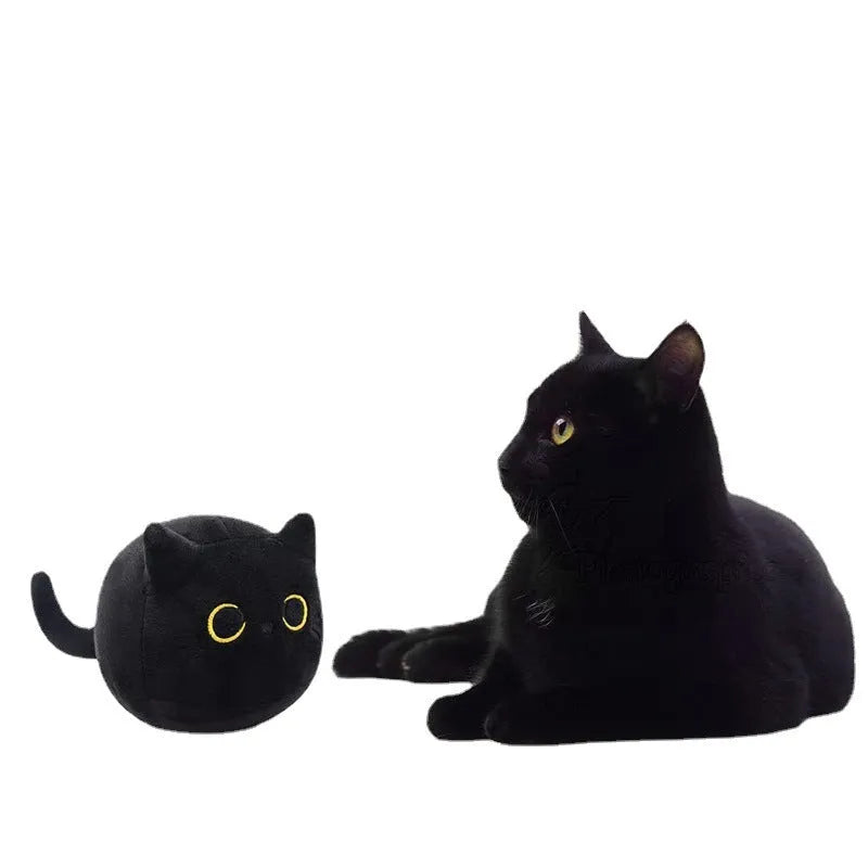 Black cat plush toy with fluffy fur and cushion design for napping