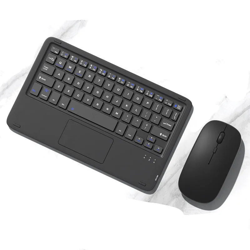 Pink Bluetooth touch keyboard and rechargeable wireless mouse on a desk next to a tablet.