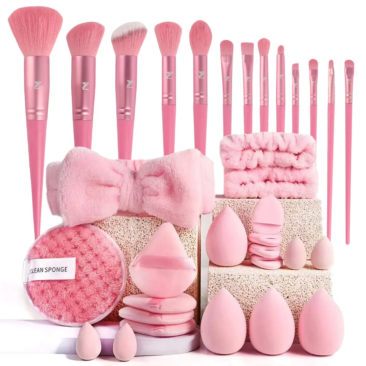 Hydrophilic non-latex beauty tools set with brushes in brown, pink, and purple colours for face washing and makeup