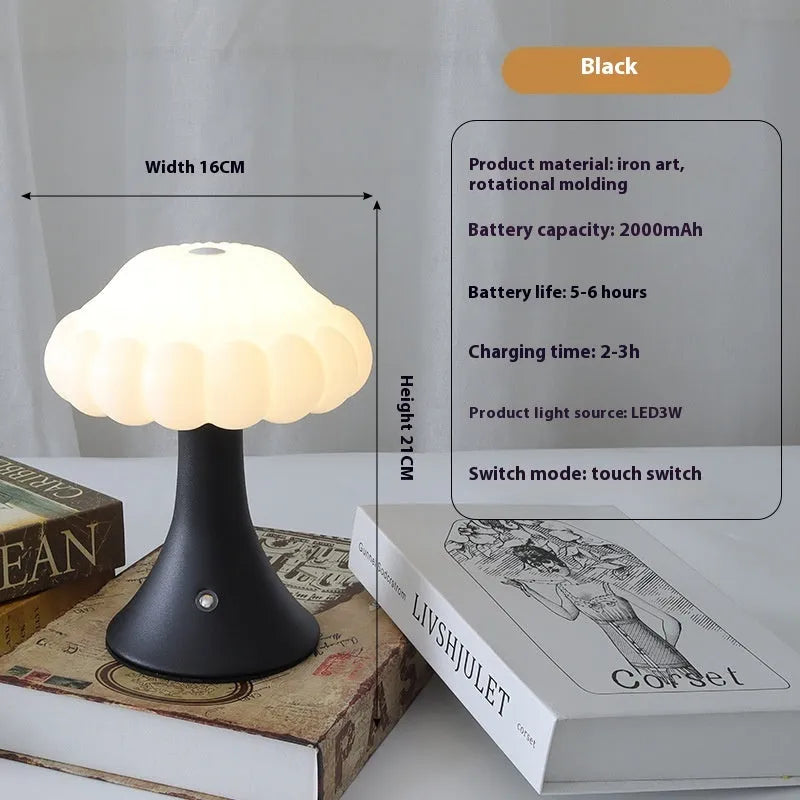 Small mushroom-shaped touch night lamp in wood grain finish on a wooden table.