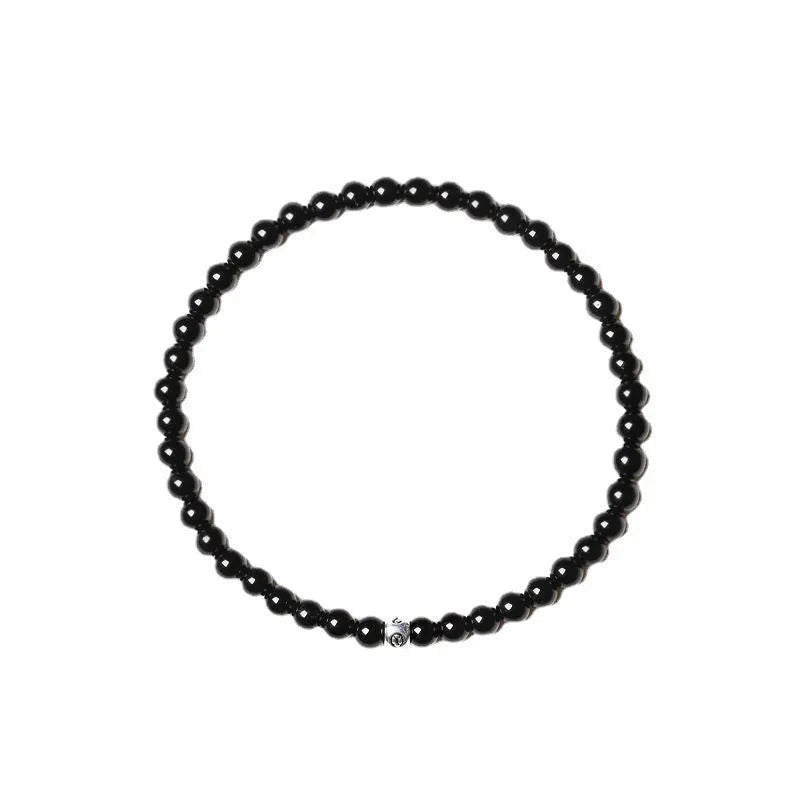 Geometric agate bracelet with obsidian, blue San, and black agate stones on wrist