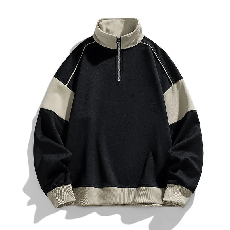 A man's thin corduroy hooded pullover sweater with drop shoulders and loose lapels, in a neutral colour.
