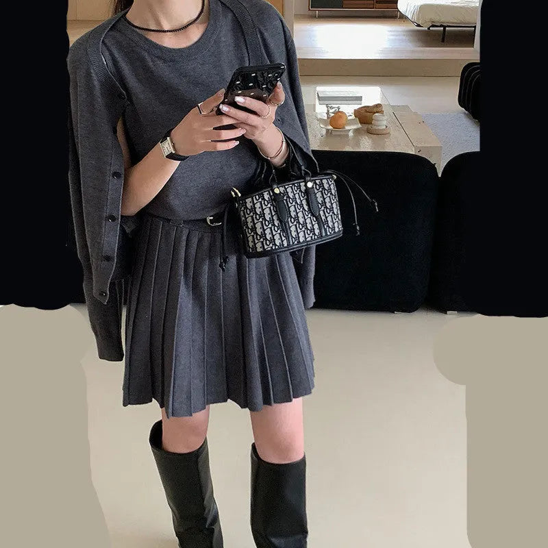 Women's grey art retro knitted vest skirt and cardigan two-piece set with 3D pattern.
