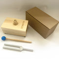 Aluminium alloy 432Hz tuning fork with acoustic speaker on kraft paper background