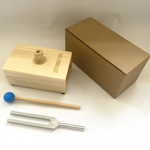 Aluminium alloy 432Hz tuning fork with acoustic speaker on kraft paper background