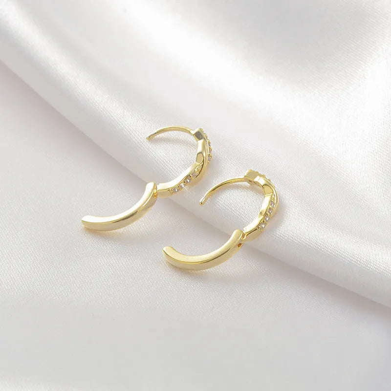Geometric copper earrings with interwoven hemp rope detailing in gold colour