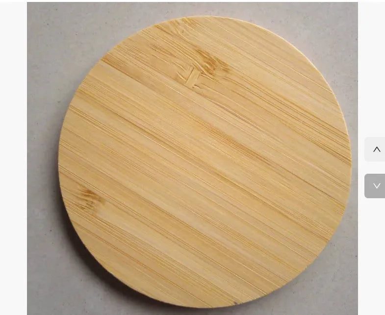 Square wooden bamboo 5W Qi wireless charging pad for smartphones on a table.