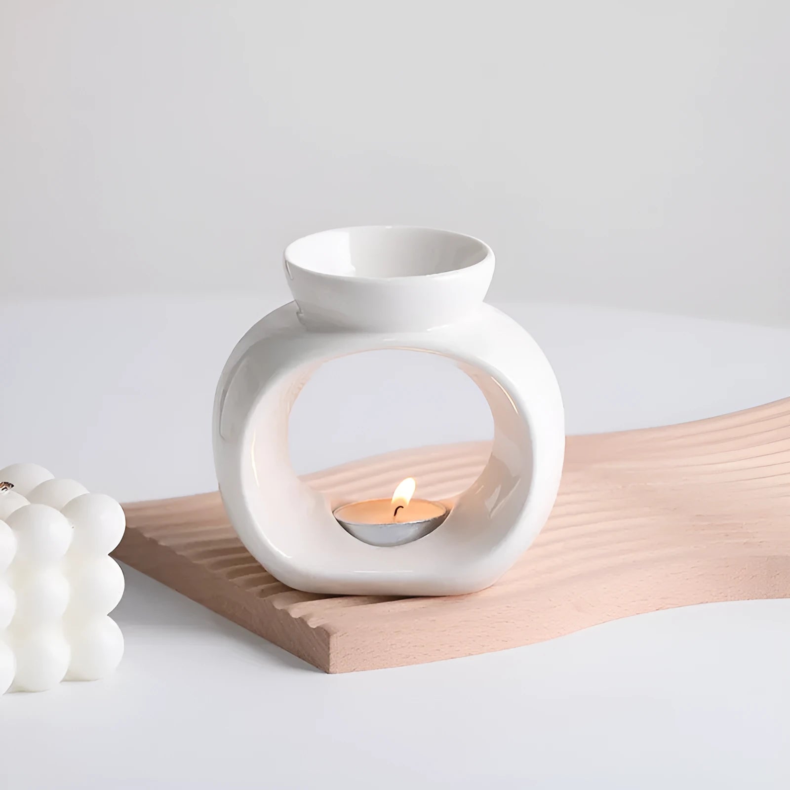 White ceramic Nordic style aromatherapy stove ornament with anti-dry burning design.