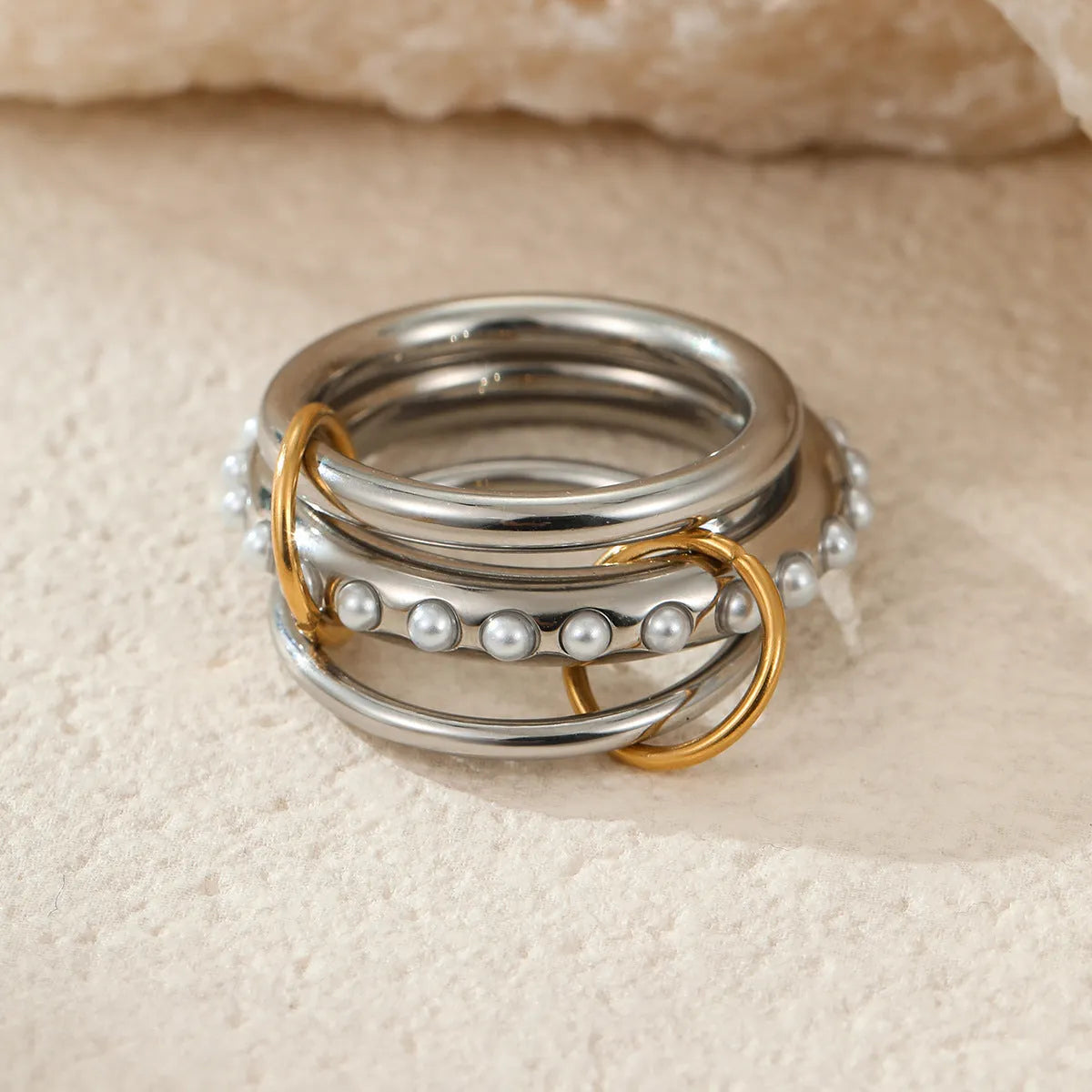 Stacked stainless steel ring with 18K gold plating in three colour variants for women's hand jewellery