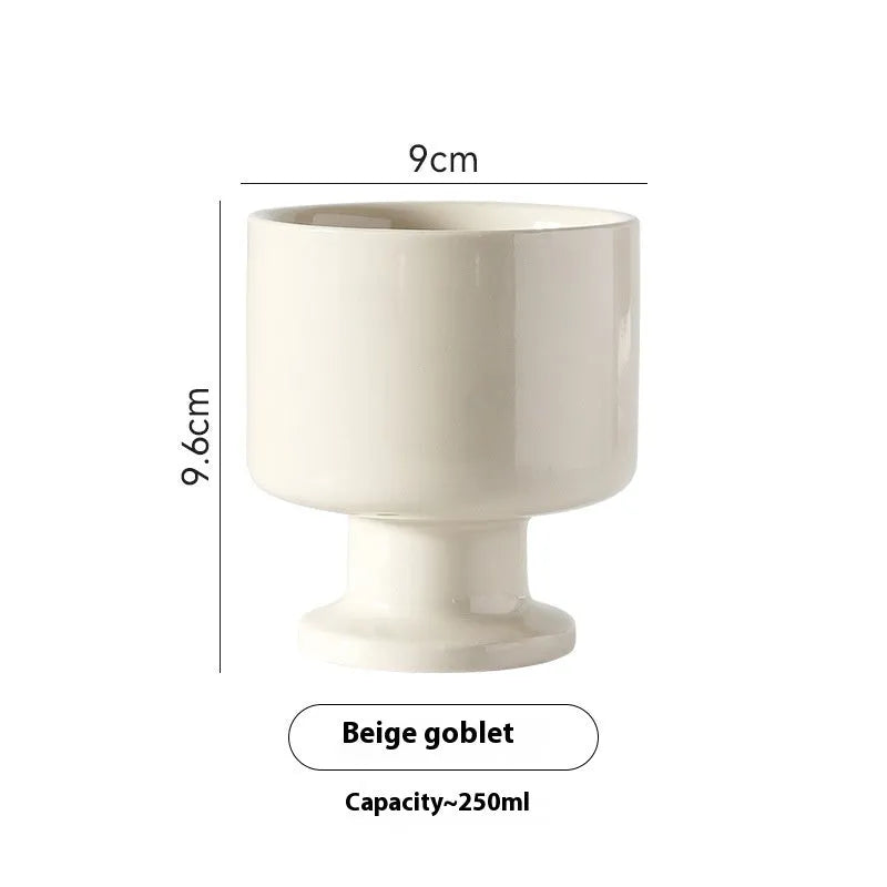 Hand-pinched irregular ceramic mug in solid colour with modern design